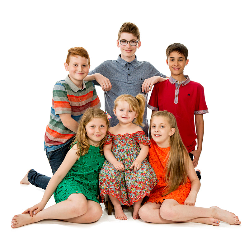 Studio photo shoot of six children in a group.