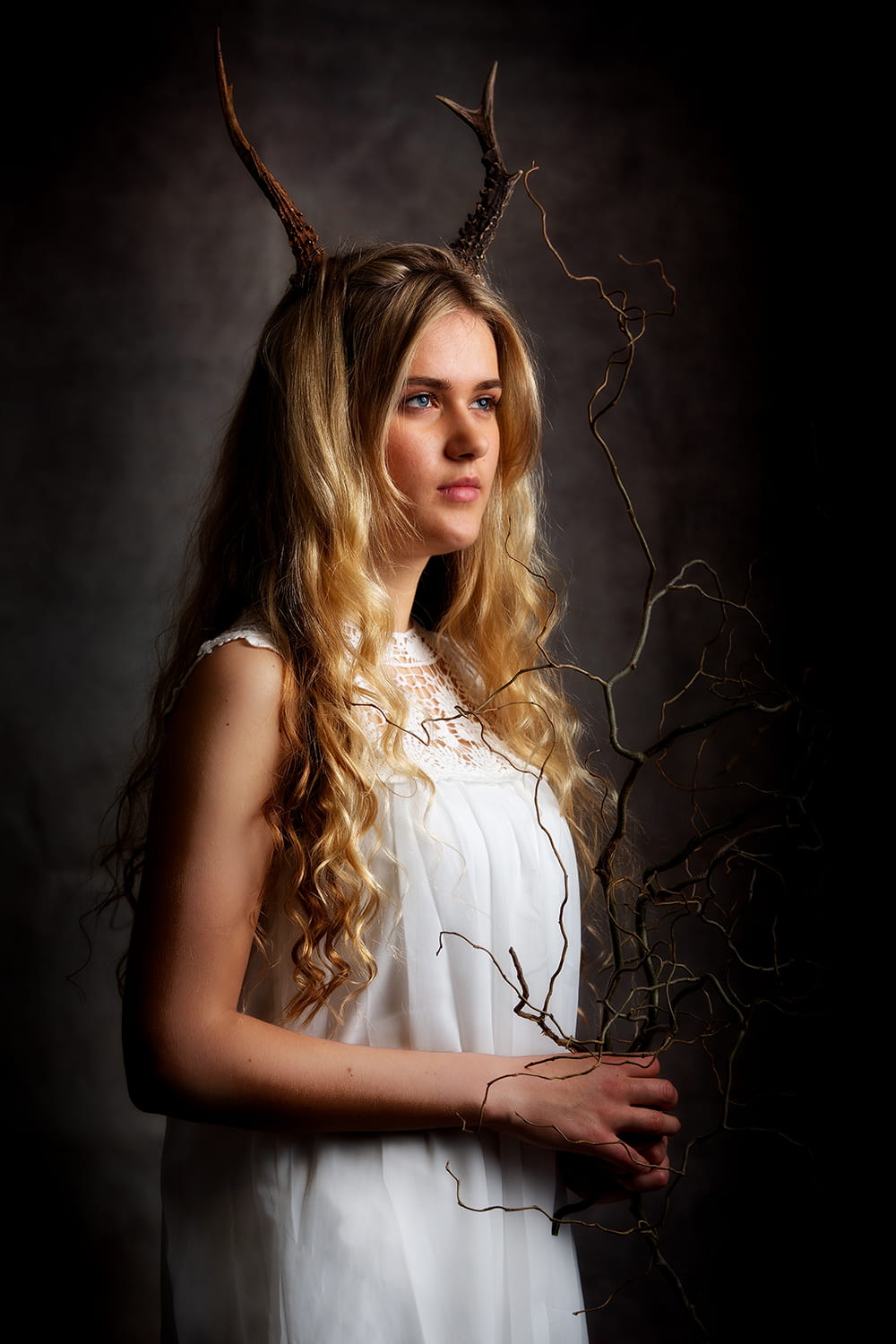 Fine art photograph of teen wearing Antlers